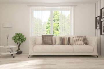 White living room with sofa and summer landscape in window. Scandinavian interior design. 3D illustration