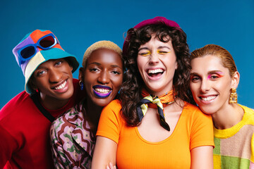Smiling multiracial friends in trendy outfits
