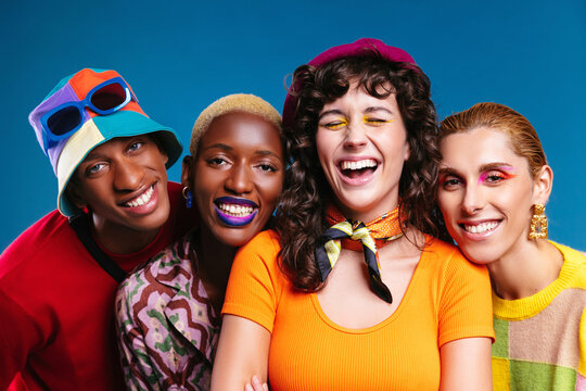Smiling multiracial friends in trendy outfits