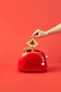 Woman holding toast with heart