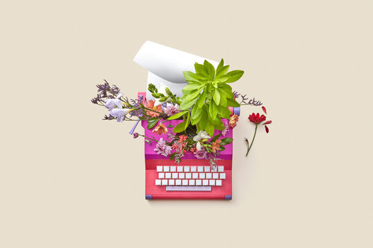 Vintage typewriter with flowers and paper