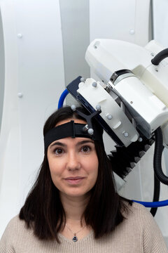 Woman patient receiving TMS procedure