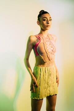 Gen z woman neon light portrait in summer clothes