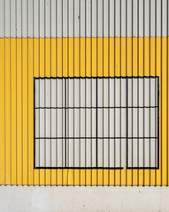 Corrugated Metal with Saffron Yellow, silver Gray, and Black Lines.