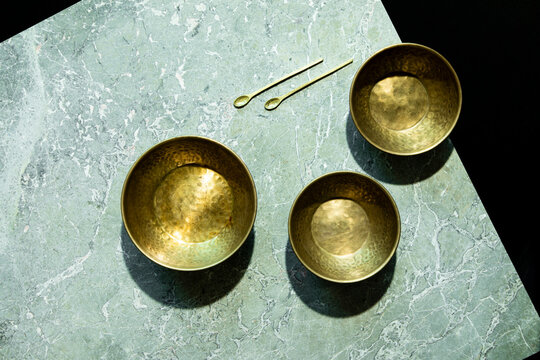 Green marble and brass bowls 