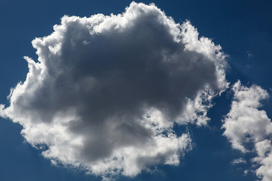 White cloud in front of a blue sky