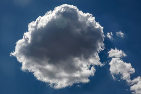 White cloud in front of a blue sky