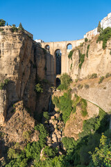 Fototapeta na wymiar Puente Nuevo (New bridge) over El Tajo gorge in the famous white village of Ronda at daylight, Malaga province, Andalusia, Spain
