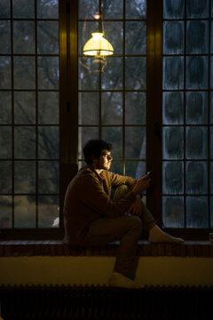 Man using phome at home at night 