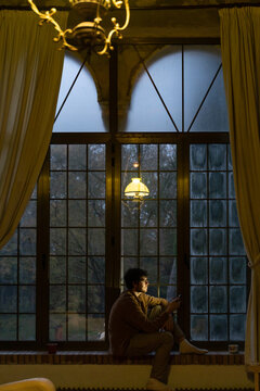 Man using phome at home at night 