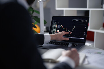 Unrecognizable trader engaging In stock trading