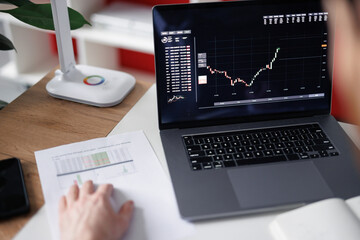 Faceless broker checking stock prices