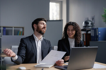 Happy coworkers working together in trade company