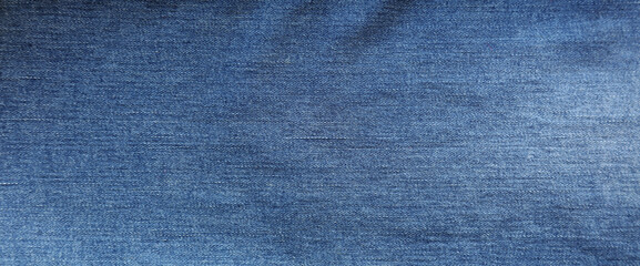 Close-up of blue denim jeans fabric texture background