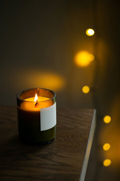 Burning natural candle with a wooden wick