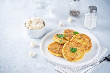 Cauliflower burgers with carrot and parsley