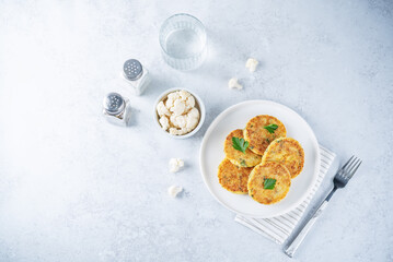 Cauliflower burgers with carrot and parsley