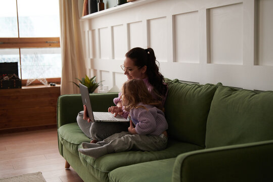 Mother and daughter with a laptop,