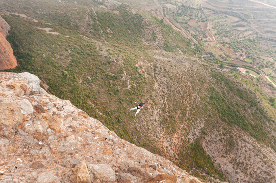 BASE jumper ready to take off from summit