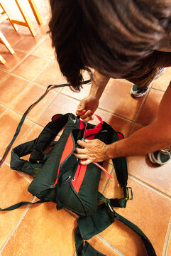 BASE jumper checking and assembling the parachute