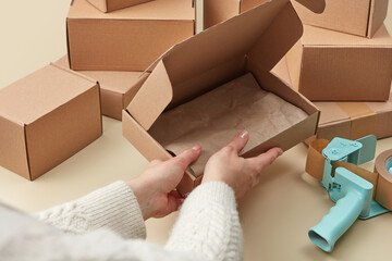 Delivery service worker packing parcel boxes