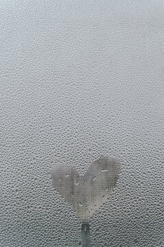 Heart Drawn in Water Droplets