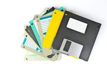  A pile of 3.5 Inch Floppy disks for background. Retro digital storage technology.