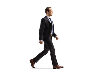 Profile shot of a businessman walking