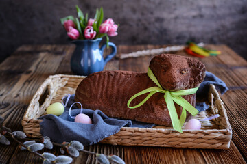 Classic chocolate Easter lamb pound cake sprinkled with cocoa powder