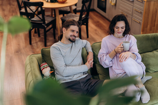 Couple watching movie on couch