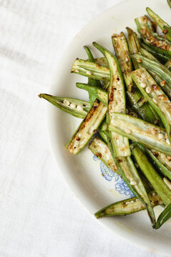 Close up sliced fried okra with garlic