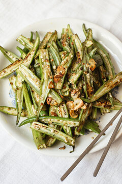 Plate of sliced fried okra with garlic