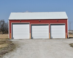 Fototapeta na wymiar Metal Garage with Three Garage Doors