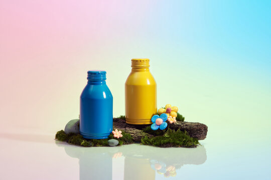 Yellow and blue aluminum soda-cans on colorful background. 