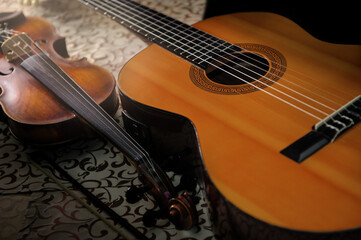 classical acoustic guitar and violin on the table