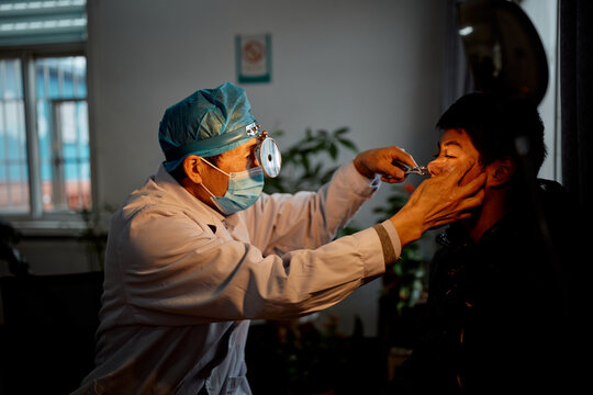 Doctor performing a test on a teenager at the hospital