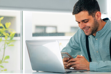 businessman with mobile phone or smartphone and computer