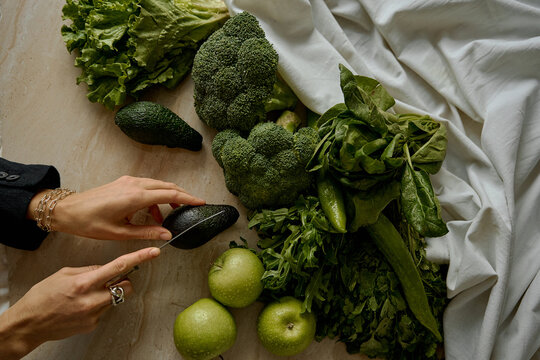 hands cut avocado