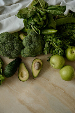 natural products avocado greens and apples  at home
