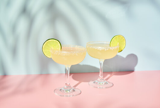 Two Lime Margaritas on Pink and Blue 