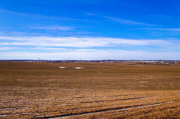Spring landscape with empty fields and meadows for background. Agricultural industry