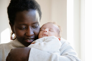 New mom hugging her baby