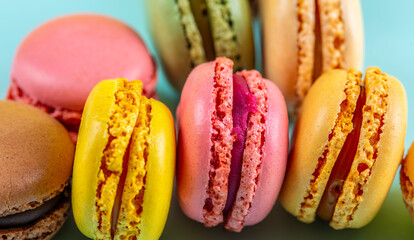 Close-up of macarons cakes of different colors .Culinary and cooking concept. Tasty colorful macaroons.