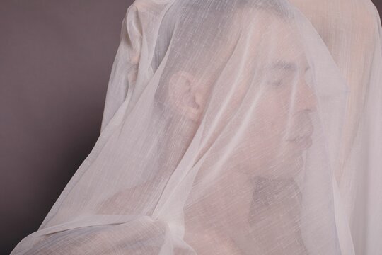 Anonymous man under the veil