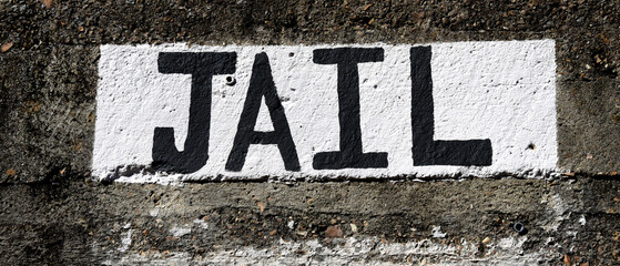 Concrete Jail Sign in Black and White