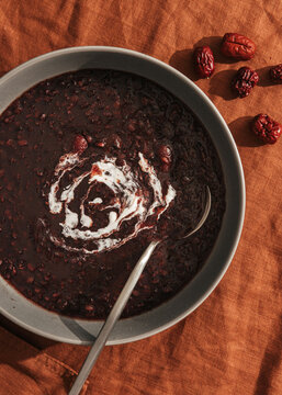 Purple rice congee with coconut cream