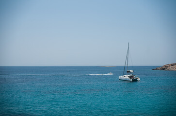 Fototapeta premium In summer the Greek island is packed with rich jet-setters and cruise-ship tourists. If you travel to Syros during this time, expect high prices, crowded beaches, and a non-stop party atmosphere