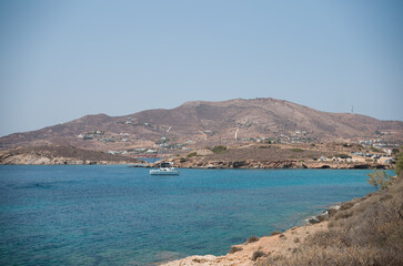 Fototapeta na wymiar In summer the Greek island is packed with rich jet-setters and cruise-ship tourists. If you travel to Syros during this time, expect high prices, crowded beaches, and a non-stop party atmosphere