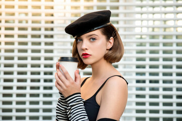 Young woman with cup of coffee or tea.