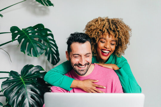 Man and Woman Using Laptop